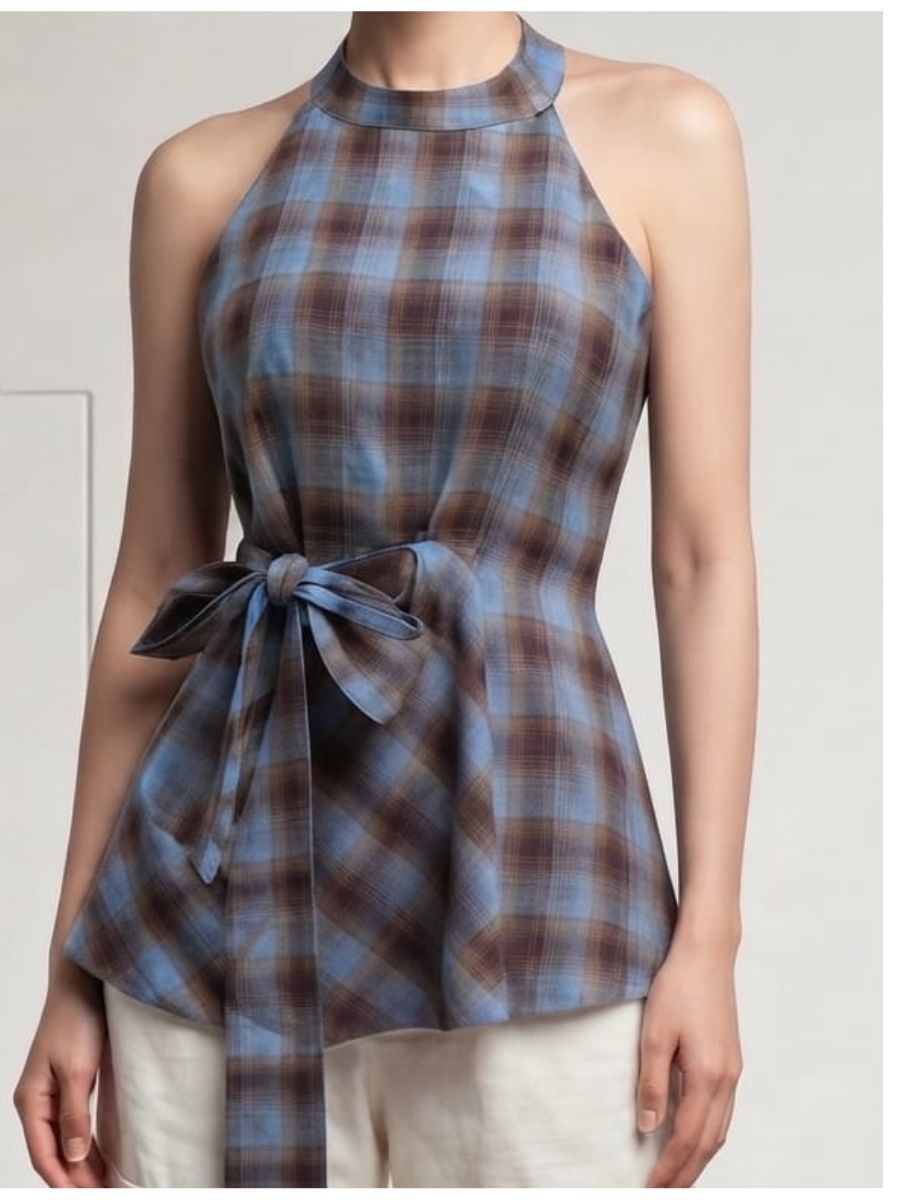 designed with a flattering halter neckline and a self-tie waist belt for a feminine silhouette